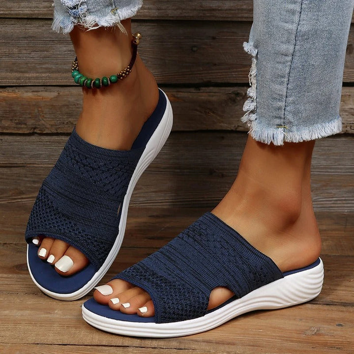 "Women's orthopedic open-toe knit sandals with contoured sole, stretch-knit upper, and slip-on design for comfort and style."