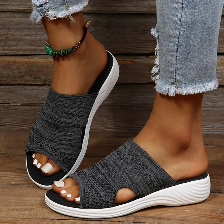 "Women's orthopedic open-toe knit sandals with contoured sole, stretch-knit upper, and slip-on design for comfort and style."