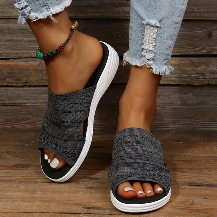 "Women's orthopedic open-toe knit sandals with contoured sole, stretch-knit upper, and slip-on design for comfort and style."
