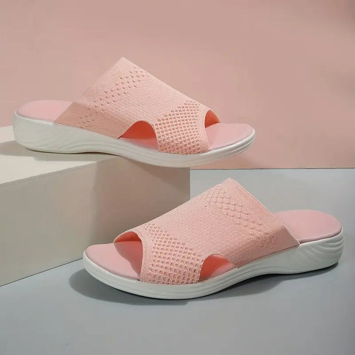 "Women's orthopedic open-toe knit sandals with contoured sole, stretch-knit upper, and slip-on design for comfort and style."