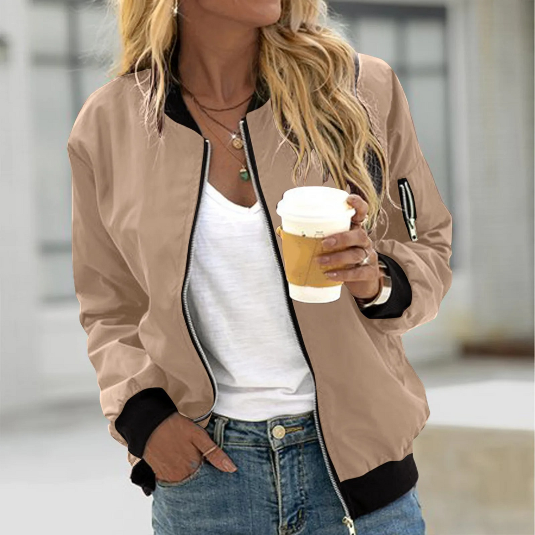 "Women's relaxed fit bomber jacket with zip pocket, lightweight and breathable, ideal for spring/fall in vibrant colors."