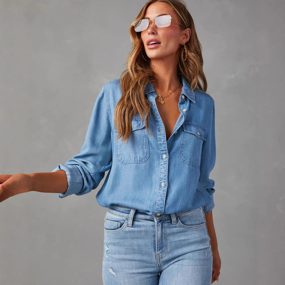 "Women's relaxed fit denim shirt with button-down front, chest pockets, in light blue, perfect for casual elegance."