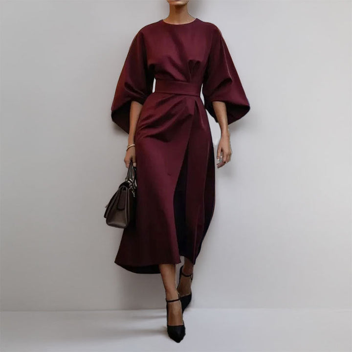 Women's satin batwing maxi dress, elegant draped silhouette, fitted waist, flowing skirt, perfect for formal occasions.