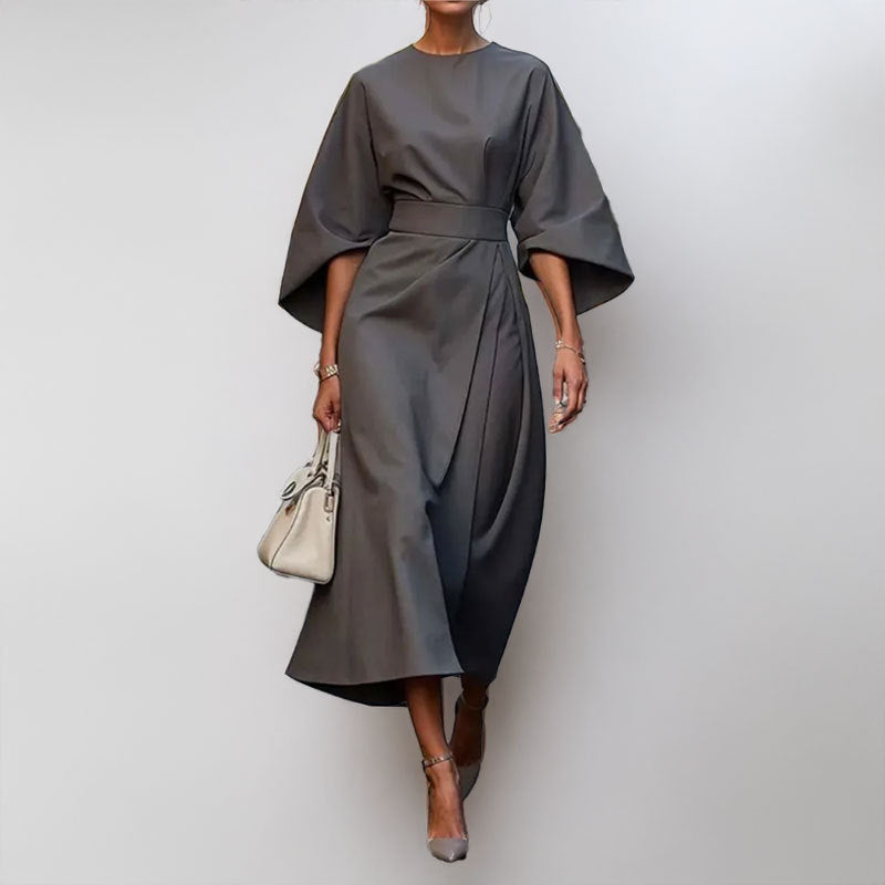 Women's satin batwing maxi dress, elegant draped silhouette, fitted waist, flowing skirt, perfect for formal occasions.