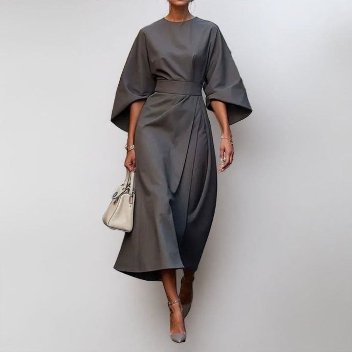 Women's satin batwing maxi dress, elegant draped silhouette, fitted waist, flowing skirt, perfect for formal occasions.