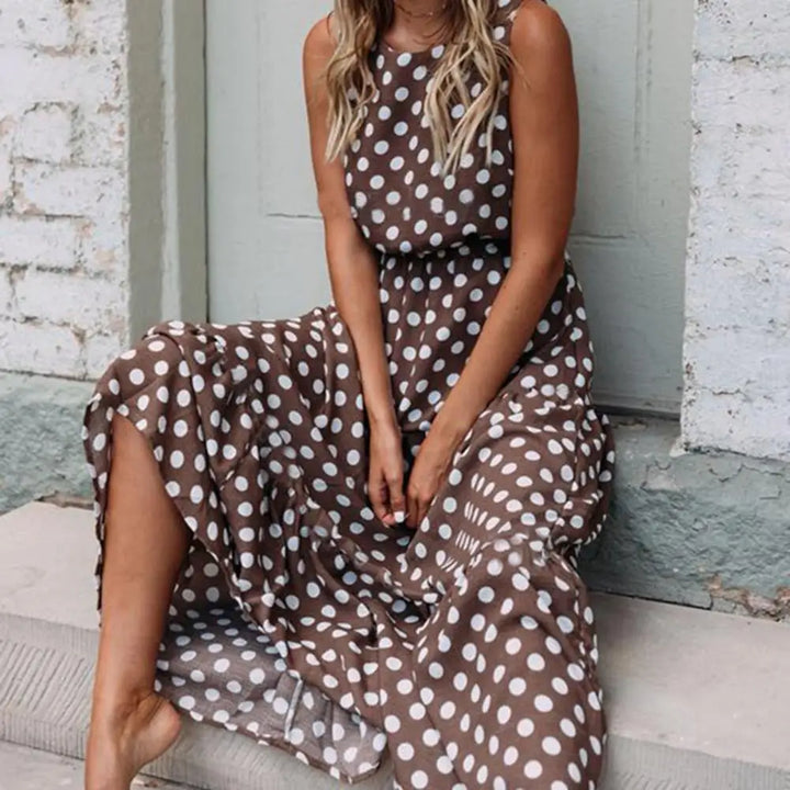 "Women's sleeveless polka dot maxi dress, vintage vibe, flowing fit, sleeveless for comfort, perfect for casual outings."