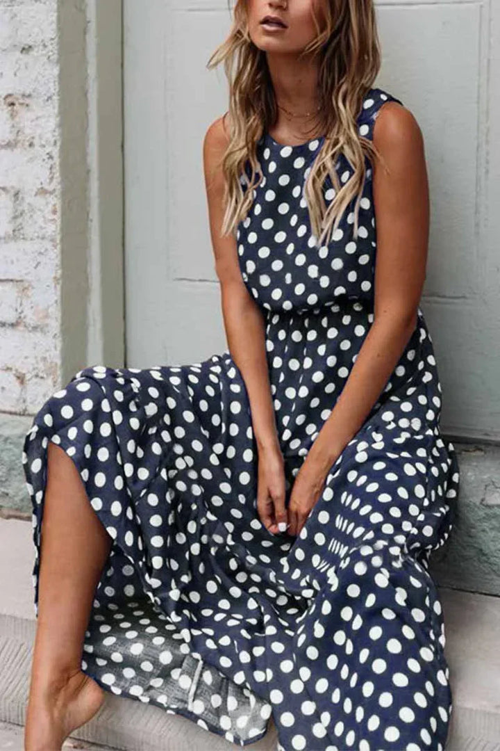 "Women's sleeveless polka dot maxi dress, vintage vibe, flowing fit, sleeveless for comfort, perfect for casual outings."