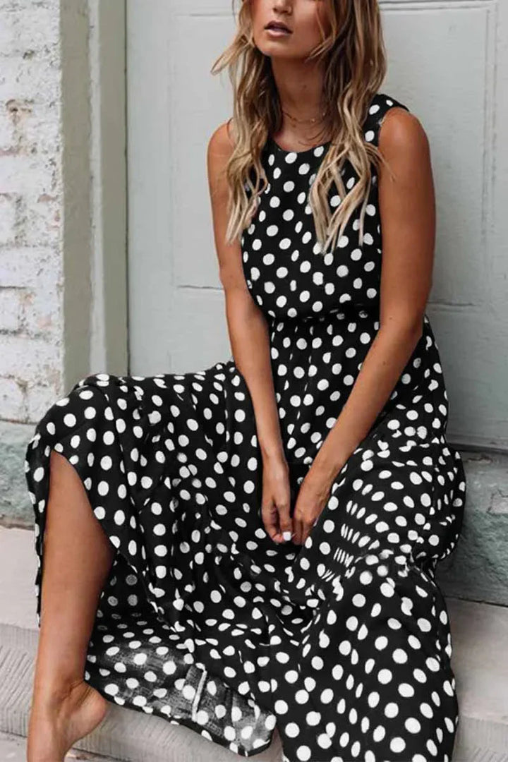 "Women's sleeveless polka dot maxi dress, vintage vibe, flowing fit, sleeveless for comfort, perfect for casual outings."