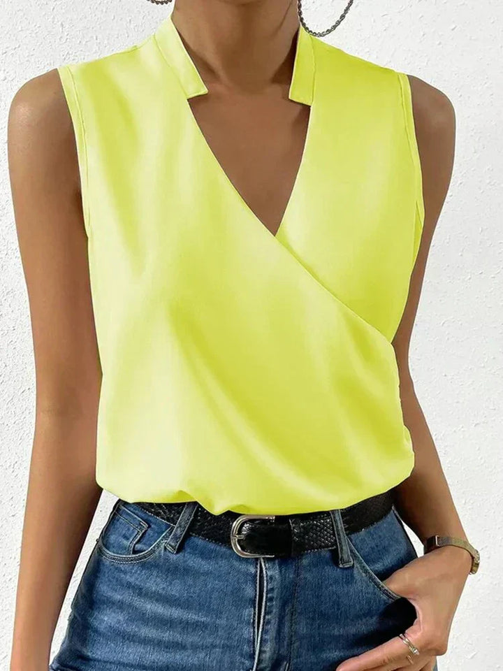 "Women's sleeveless summer blouse, white, chic and versatile design, perfect for casual or dressy occasions, breathable fabri