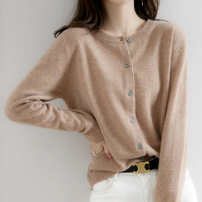 Women's soft cashmere button-up cardigan, classic design, long sleeves, versatile for casual and formal outfits.