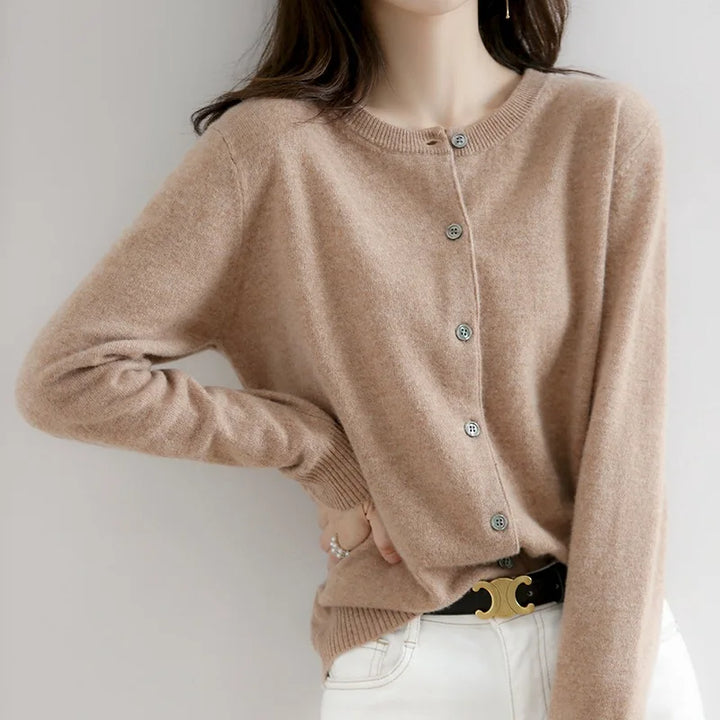 Women's soft cashmere button-up cardigan, classic design, long sleeves, versatile for casual and formal outfits.