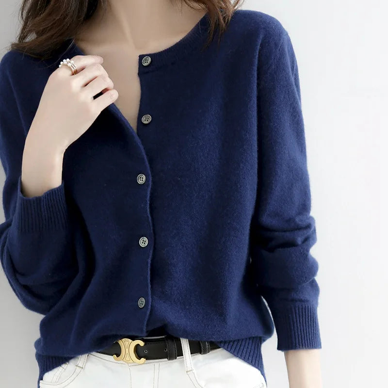Women's soft cashmere button-up cardigan, classic design, long sleeves, versatile for casual and formal outfits.
