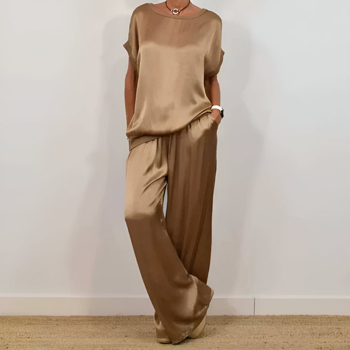 "Women's soft co-ord set with wide-leg trousers and short sleeve top in neutral hues, depicting elegance and comfort."