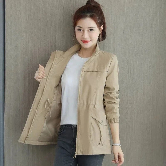 Women's spring trench coat, khaki, mid-length, with adjustable waist and button-down closure, perfect for breezy days.