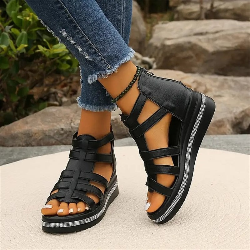 Women's strappy platform sandals with ankle coverage, bold multi-strap design, flat platform sole, back zip closure.