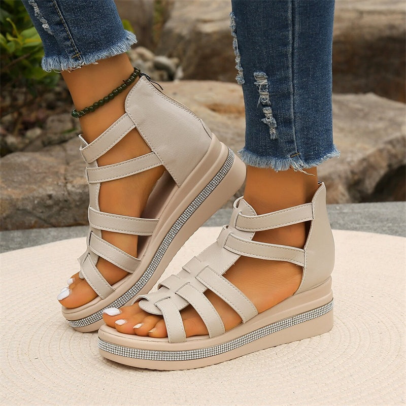 Women's strappy platform sandals with ankle coverage, bold multi-strap design, flat platform sole, back zip closure.