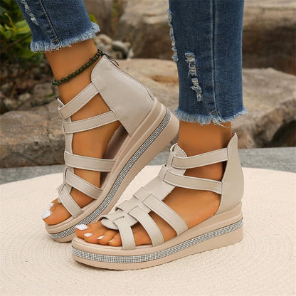 Women's strappy platform sandals with ankle coverage, bold multi-strap design, flat platform sole, back zip closure.