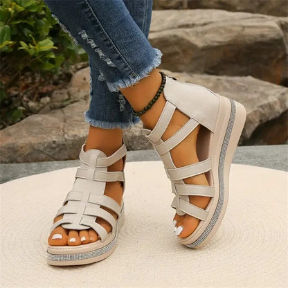 Women's strappy platform sandals with ankle coverage, bold multi-strap design, flat platform sole, back zip closure.