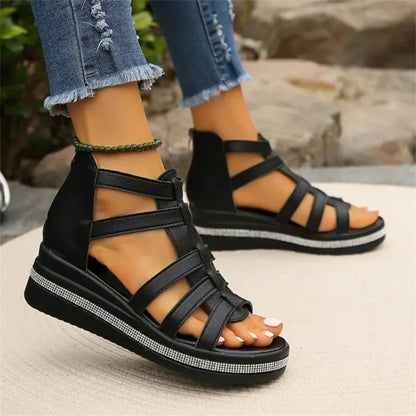 Women's strappy platform sandals with ankle coverage, bold multi-strap design, flat platform sole, back zip closure.