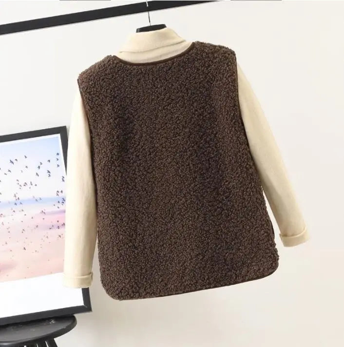 "Women's stylish fleece vest, front view, showing textured design, sleeveless, perfect for winter warmth and elegant style."