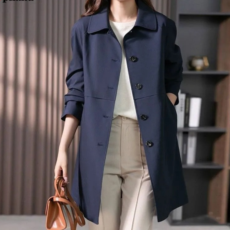 Women's stylish short trench coat with single-button closure, classic silhouette, sleek tailoring, ideal for various settings