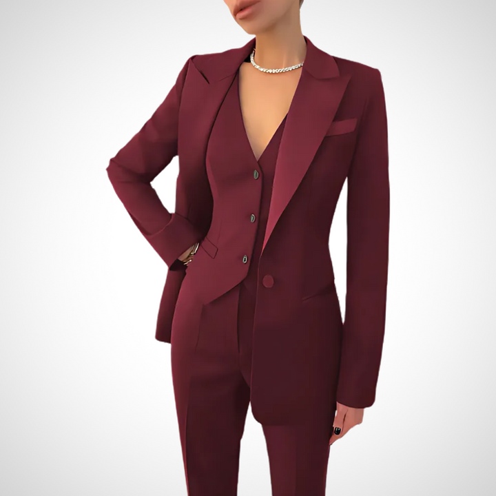 "Women's tailored three-piece suit, elegant blazer, vest, and pants, available in black, red, green, and gray."