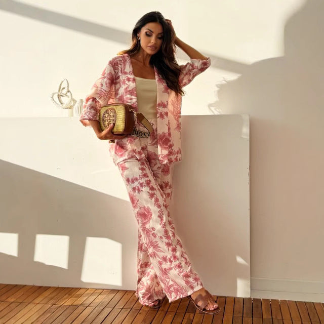 Women's two-piece floral set with a long sleeve top and wide-leg pants, featuring a colorful print and relaxed fit.