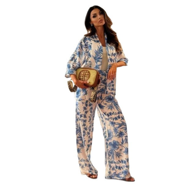 Women's two-piece floral set with a long sleeve top and wide-leg pants, featuring a colorful print and relaxed fit.