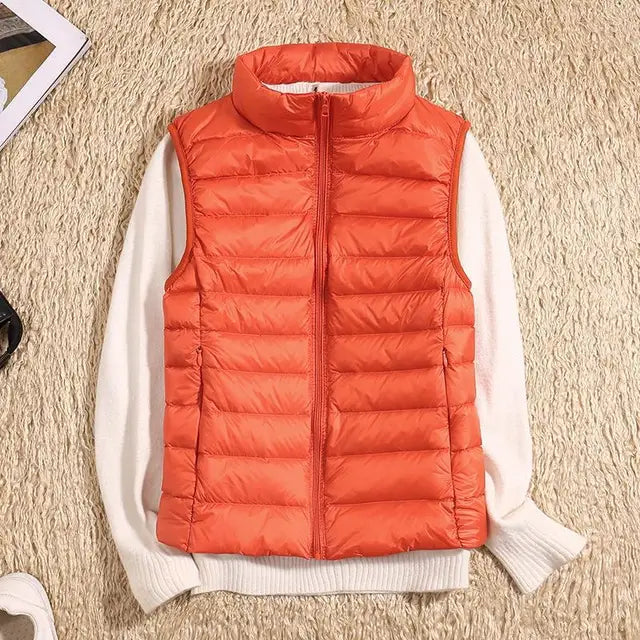 Women's ultra light down vest, warm, lightweight, sleeveless in sleek design, ideal for layering, perfect for chilly days.