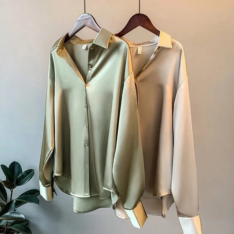 Women's vintage silk blouse with tailored fit, chic design, elegant silhouette, and luxurious lightweight fabric.