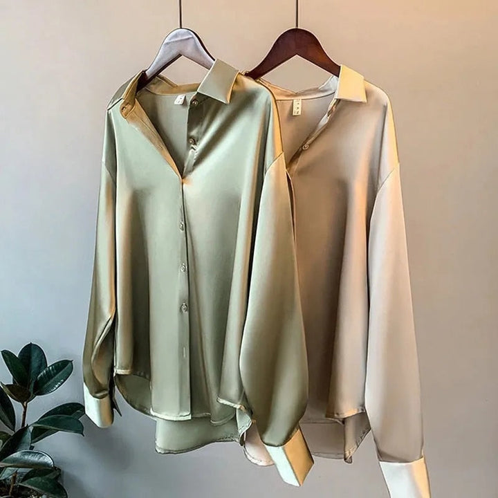 Women's vintage silk blouse with tailored fit, chic design, elegant silhouette, and luxurious lightweight fabric.