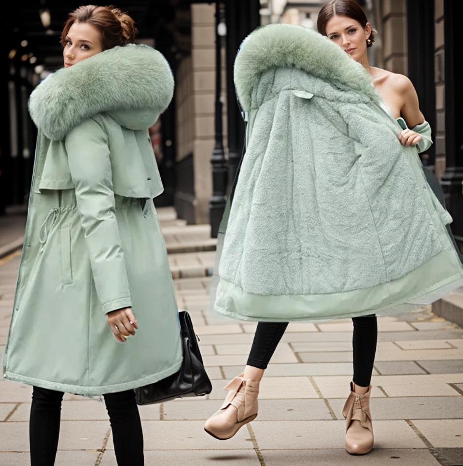 Women's warm waterproof winter coat, modern fit, sleek design, with hood and adjustable cuffs for wet conditions.