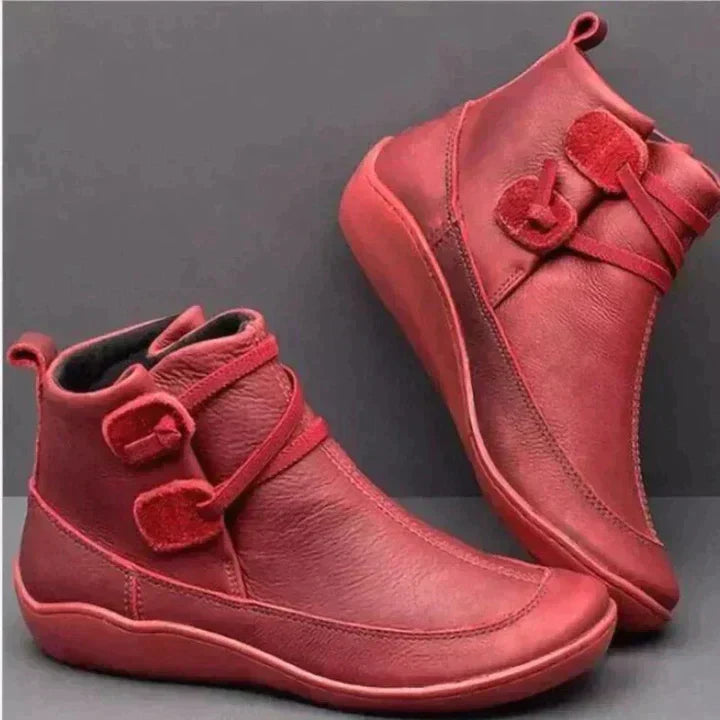 Women's waterproof ankle boots, cushioned interior, non-slip rubber sole, pull-on design, stylish loop strap, round toe.