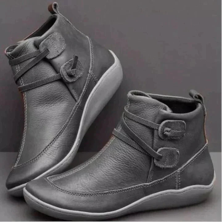 Women's waterproof ankle boots, cushioned interior, non-slip rubber sole, pull-on design, stylish loop strap, round toe.