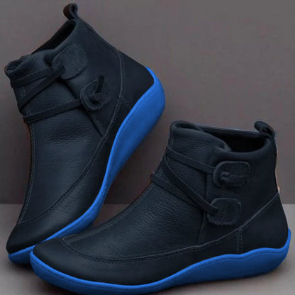 Women's waterproof ankle boots, cushioned interior, non-slip rubber sole, pull-on design, stylish loop strap, round toe.