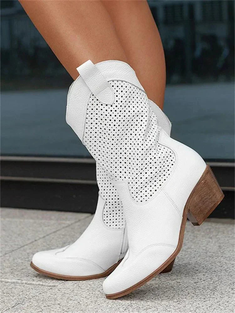 "Women's western ankle boots with pointed toe, block heel, faux leather finish, and pull-on tabs for easy wear."