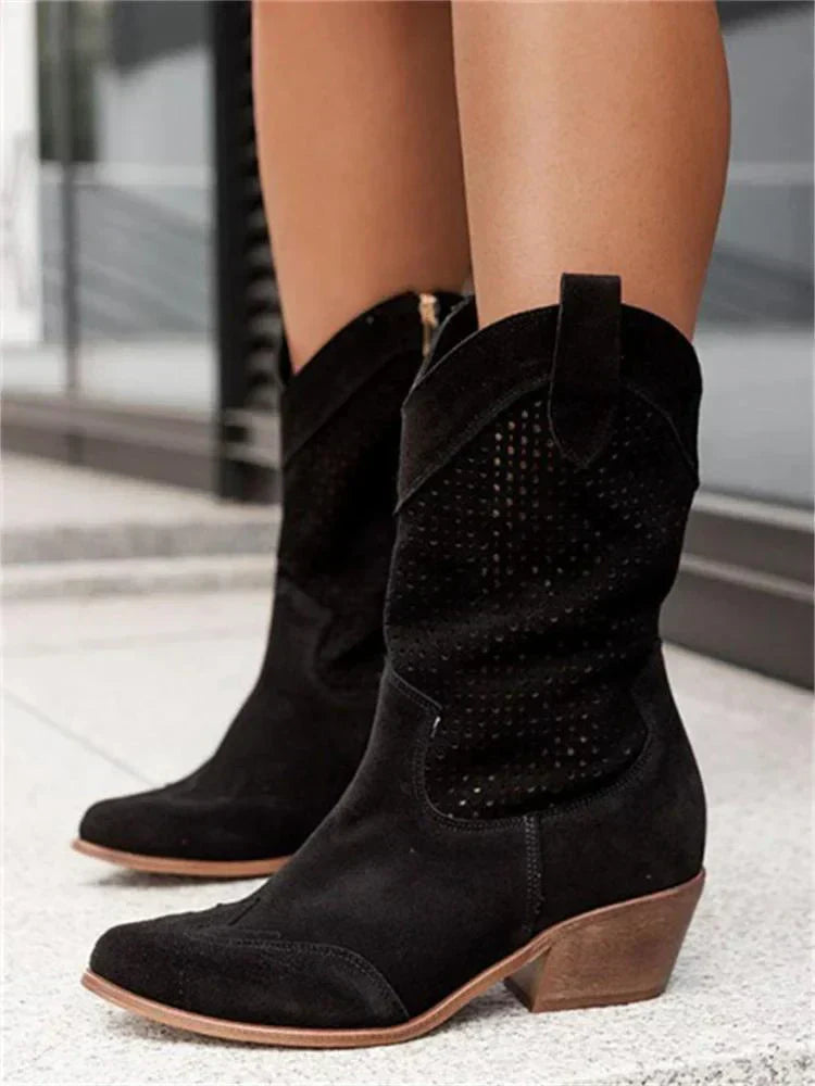 "Women's western ankle boots with pointed toe, block heel, faux leather finish, and pull-on tabs for easy wear."