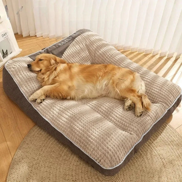 "XXL orthopedic dog bed with plush fabric and removable cover, ideal for large dogs, featuring anti-slip bottom and headrest.
